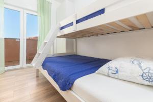 Postel nebo postele na pokoji v ubytování Kuća Lana