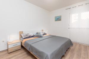 Postel nebo postele na pokoji v ubytování Kuća Lana