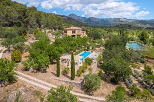 an aerial view of a home with a pool and trees at Ca Nostra de Esporles Charming Estate at Esporlas for families in Esporlas