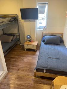 a bedroom with two bunk beds and a table at Seoul Dalbit Dongdaemun Guesthouse in Seoul