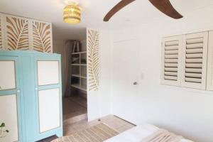 a room with a blue cabinet and a white wall at Entire Guest Suite - beach is 1 and half km - Pets Welcome in Gold Coast +52 photos