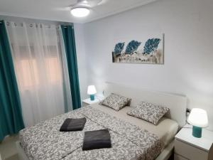 Postel nebo postele na pokoji v ubytování Apartamento Playa Cura