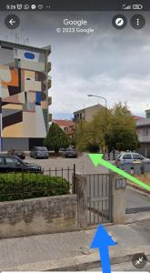 a picture of a parking lot with a green arrow at Casa Cristina “a Ragusa” in Ragusa