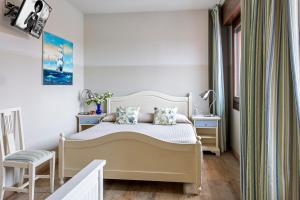 A bed or beds in a room at Hotel San Pietro