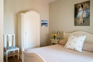 A bed or beds in a room at Hotel San Pietro