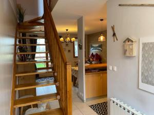 a staircase in a room with a kitchen and a kitchen at Chalet de charme à Saint Lary - Vignec in Vignec