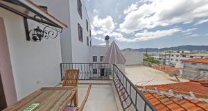 a balcony with a table and chairs on a building at Castello Marmaris Holiday Home in Marmaris