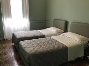 Posteľ alebo postele v izbe v ubytovaní VILLA ACTEA