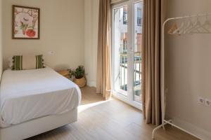 Postel nebo postele na pokoji v ubytování Apartamentos Magna Sevilla