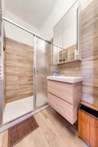 a bathroom with a shower and a sink at Between the roofs of Menton old town and the sea in Menton