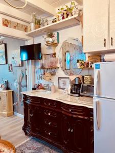 a kitchen with a sink and a refrigerator at Pool King Sweet Karma on Water Best Location Beaches,Restaurants,Hard Rock Casino in Hallandale Beach