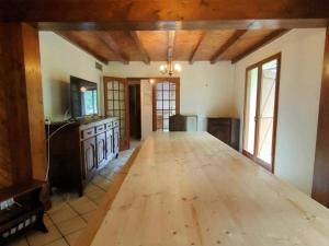 a large room with a wooden floor in a house at Maison Cauterets, 9 pièces, 15 personnes - FR-1-234-244 in Cauterets