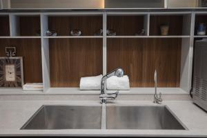 a kitchen sink with a roll of paper above it at Luxury apartments Boutique Haneviim in Jerusalem