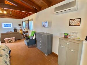 a living room with a dresser and a couch at Trulli Caroli in Locorotondo
