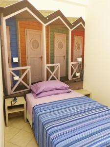 Postel nebo postele na pokoji v ubytování HOTEL D'ANNUNZIO + 15 fotografií