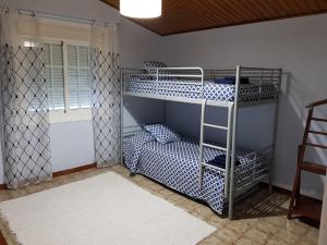 Кровать или кровати в номере Casa en entorno rural cerca de la playa