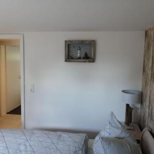 Postel nebo postele na pokoji v ubytování Ferienwohnung Ankerplatz in Schlagsdorf auf Fehmarn