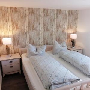 Postel nebo postele na pokoji v ubytování Ferienwohnung Ankerplatz in Schlagsdorf auf Fehmarn