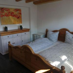 Postel nebo postele na pokoji v ubytování Ferienwohnung Ankerplatz in Schlagsdorf auf Fehmarn
