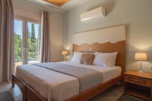 Posteľ alebo postele v izbe v ubytovaní Aris Apartments