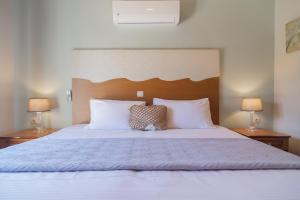Posteľ alebo postele v izbe v ubytovaní Aris Apartments