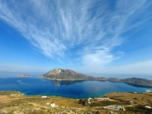 an island in the middle of a body of water at Amorgos Delight in Aegiali