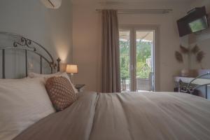Posteľ alebo postele v izbe v ubytovaní Aris Apartments