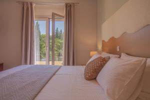 Posteľ alebo postele v izbe v ubytovaní Aris Apartments
