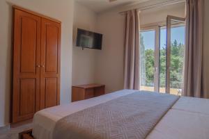 Posteľ alebo postele v izbe v ubytovaní Aris Apartments
