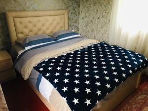 Postel nebo postele na pokoji v ubytování Butichi Guest House