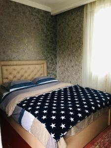 Postel nebo postele na pokoji v ubytování Butichi Guest House
