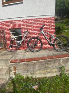 two bikes parked next to a brick wall at Pfefferberg in Ziegenrück