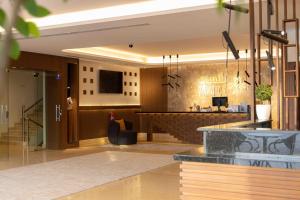 a lobby of a hotel with a bar at شقق بانسيه المخدومة in Riyadh +15 photos