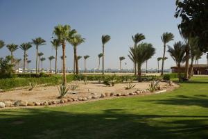 a park with palm trees and a beach at Adel's villa in Sharm El Sheikh