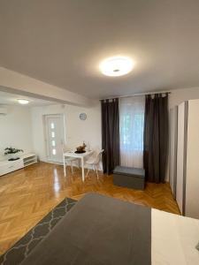 a living room with a table and a dining room at Apartment Maria in Zadar