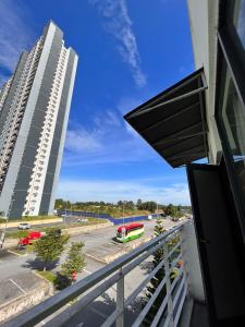 a balcony with a view of a building and a street at S8 Boutique Hotel near KLIA 1 & KLIA 2 in Sepang