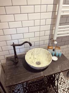 a bathroom with a sink on a table at Sno Cottage in Sno