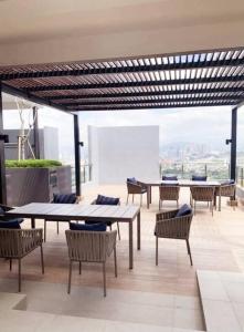 a room with tables and chairs on a building at The Nova by The City Collection in Kuala Lumpur