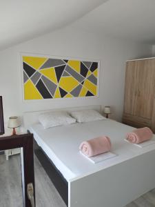 Postel nebo postele na pokoji v ubytování Apartments Jakovljevic