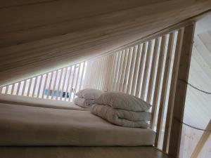 a pile of towels sitting on top of a staircase at Namelis Genio 7 in Palanga