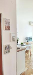 a white refrigerator in a kitchen with a table at F 207 Primorsko del Sol - просторно студио с кухня in Primorsko