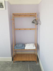 a shelf in the corner of a room at B&B No. 70 in Southport