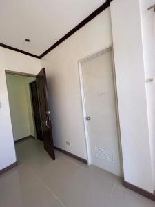 a room with a door with the word sample written on it at Jimsville executive homes in Liloan