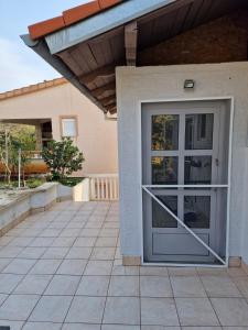 a front door of a house at Apartman Bella in Drage
