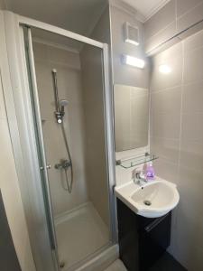 a bathroom with a sink and a shower at Appartments in the historic center near beach in Limassol