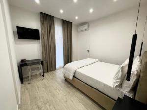 Säng eller sängar i ett rum på AROMA Apartment and b&b, Maschio Angioino