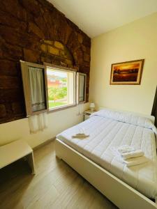 Posteľ alebo postele v izbe v ubytovaní Villa Maresa