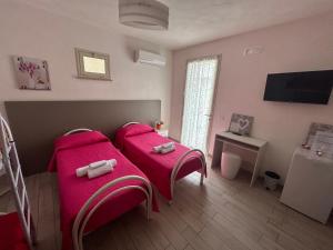 Postel nebo postele na pokoji v ubytování B & B Da Rosa