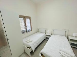 Posteľ alebo postele v izbe v ubytovaní Villa Maresa