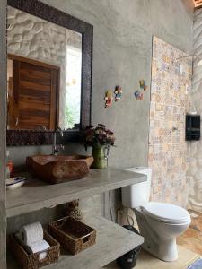 a bathroom with a sink and a toilet at Flats Macapá Meu Amor in Luis Correia